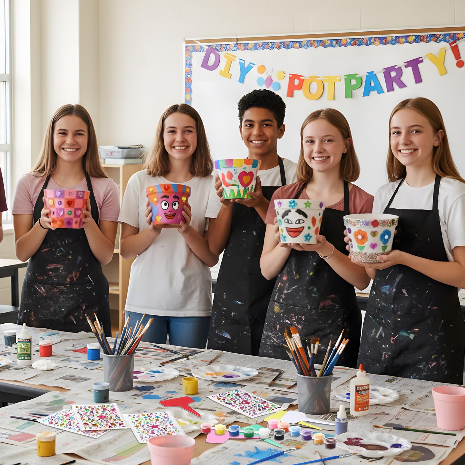 ferrochef classroom table with kids painting pots, highlighting group activity and party use
