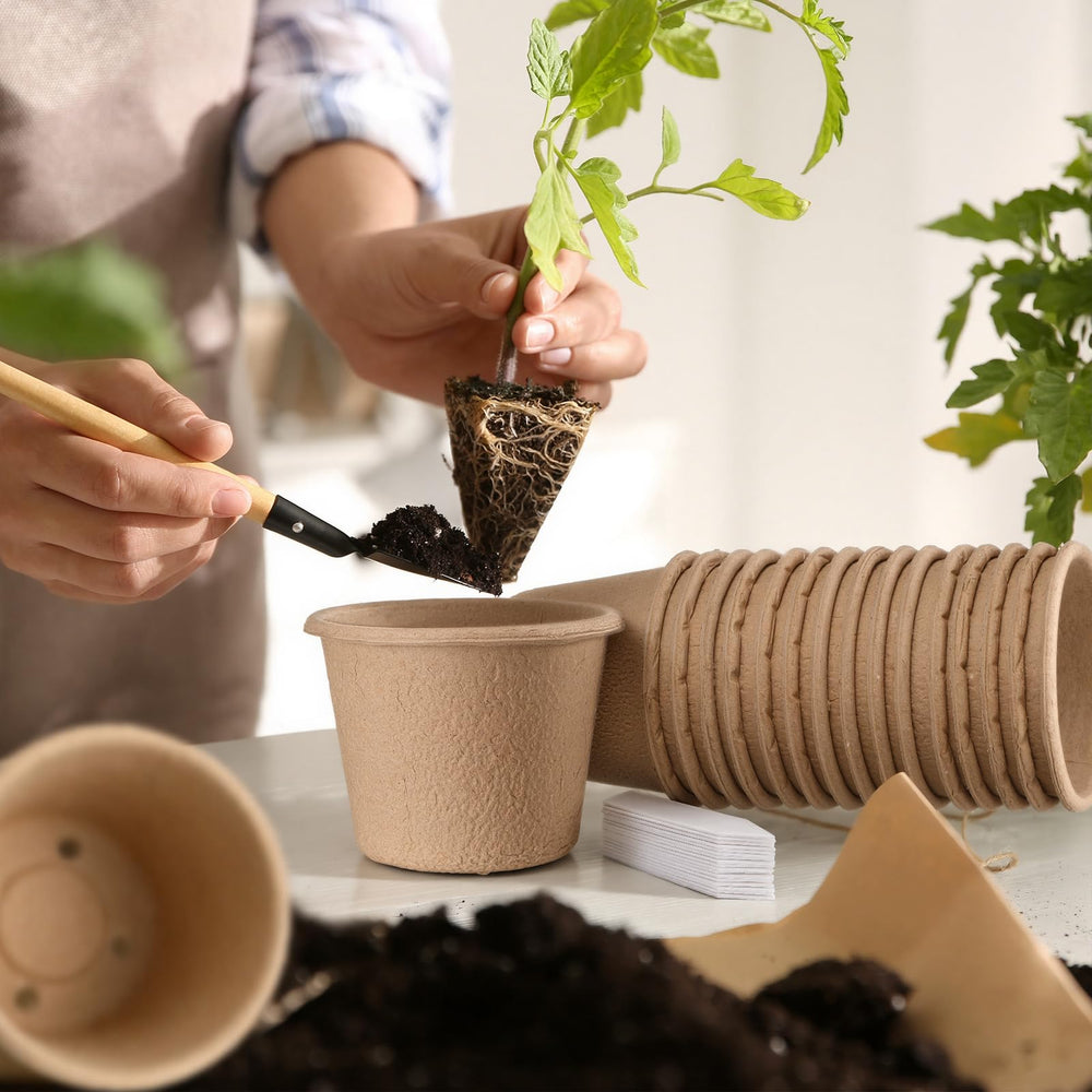 Ferrochef lifestyle shot of planting pots in garden illustrating effortless transplanting
