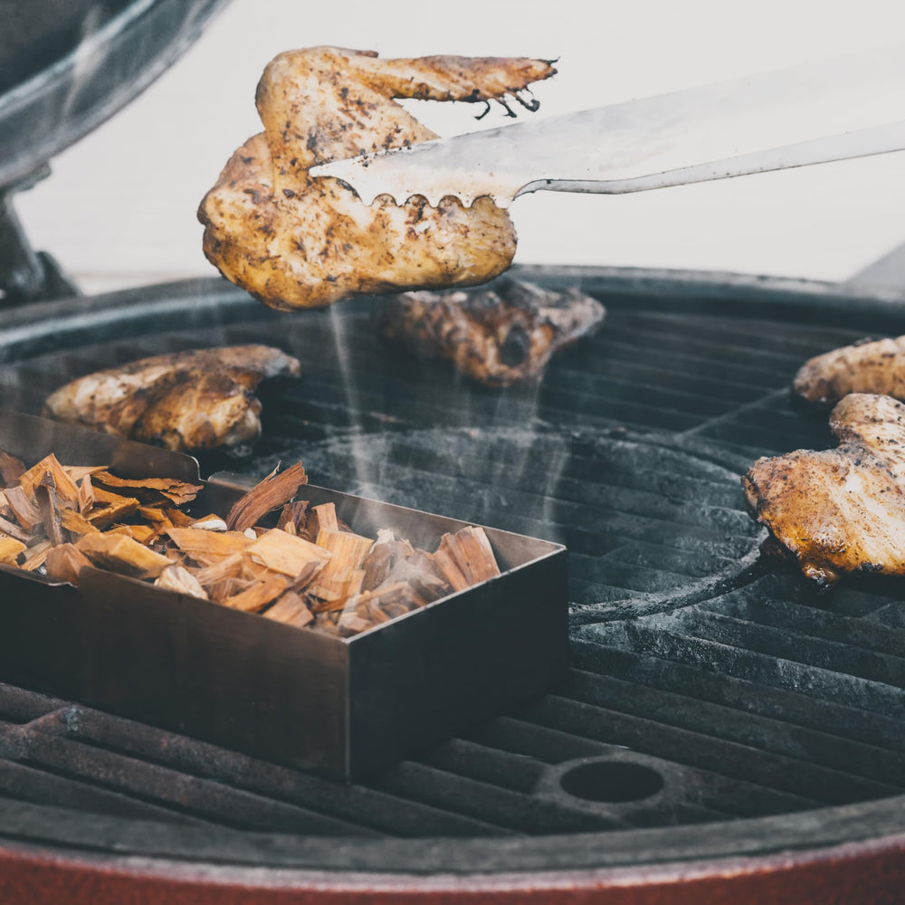 Fire & Flavor used chips on charcoal beside steak adding deep wood-fired flavor