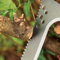 Fiskars saw cutting a vine demonstrating one-handed use and free-hand management