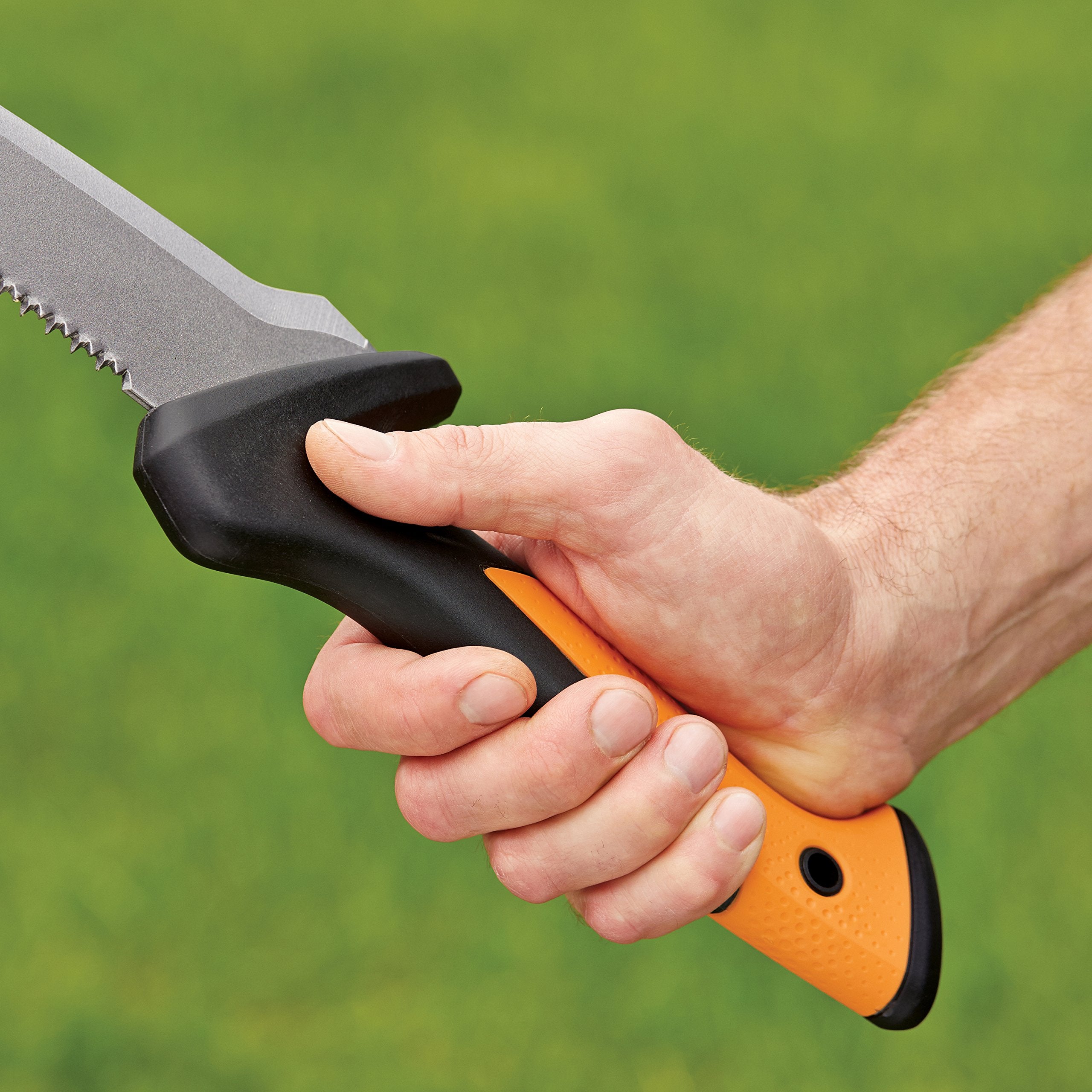 Fiskars saw resting on a garden bench illustrating practical yard cleanup use