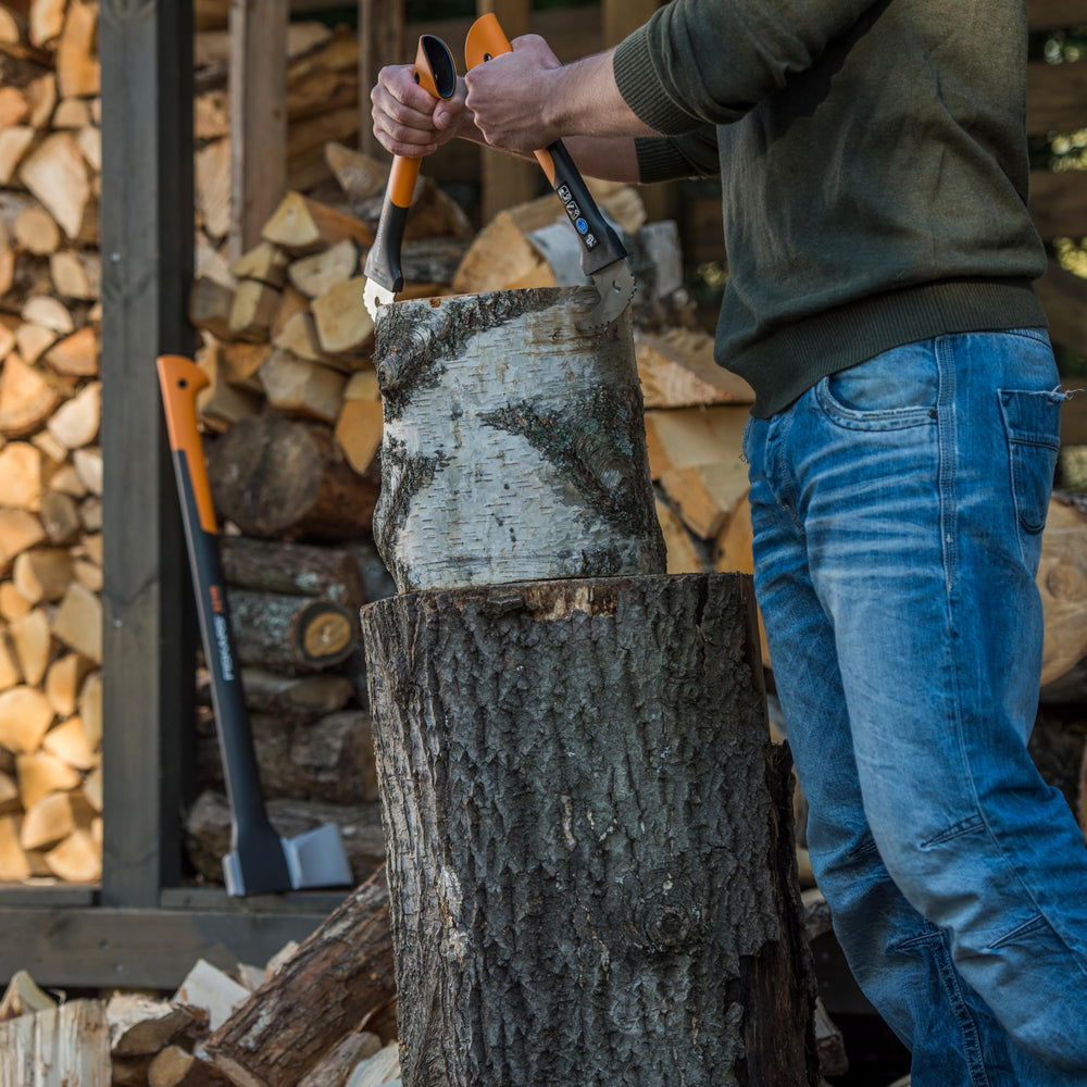 Fiskars Hookaroon in use lifting a firewood log to reduce bending and strain