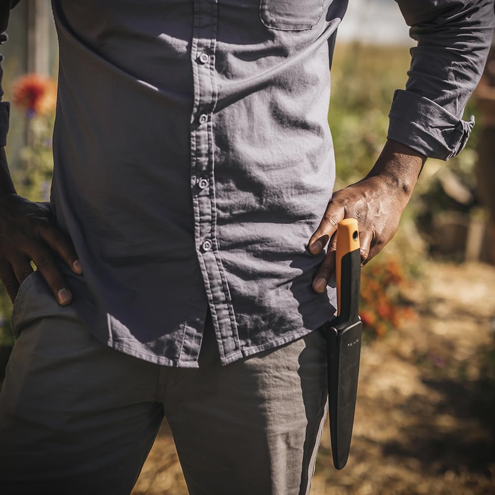 Fiskars in-garden action photo showing digging and planting efficiency