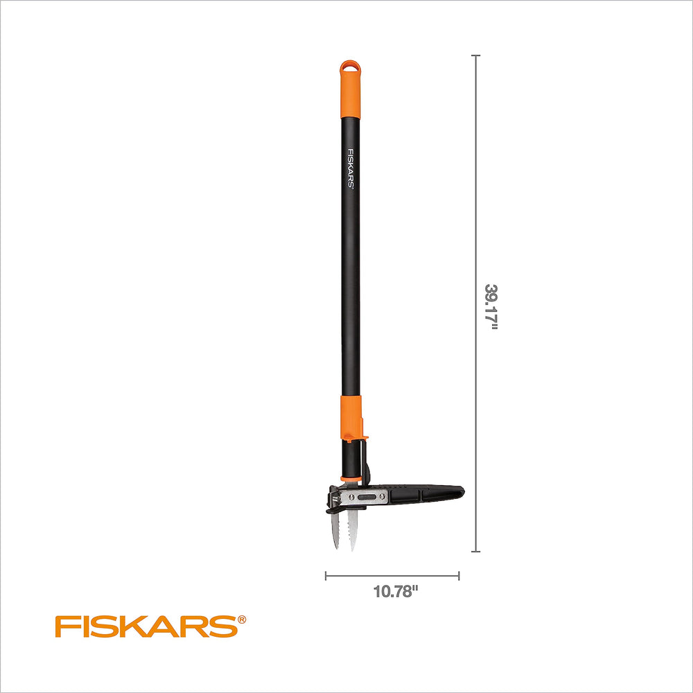 Fiskars tool in use removing a dandelion demonstrating root extraction benefit