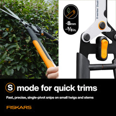 Fiskars shears in use trimming a hedge for faster shaping