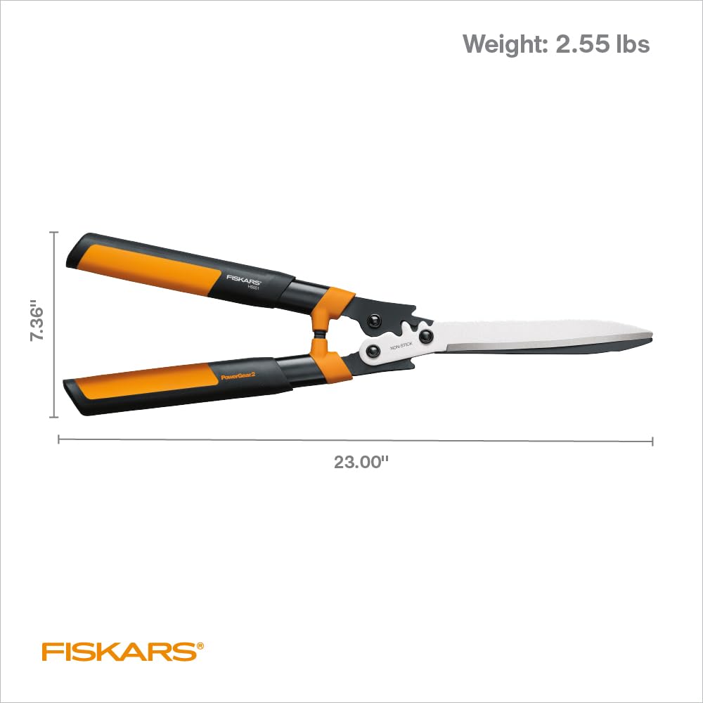 Fiskars shears on lawn near shrubs showing practical garden use benefit