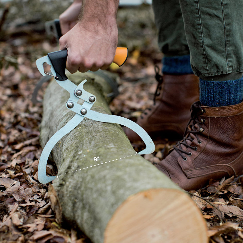 Fiskars sharpened tip close-up biting bark for secure log hold benefit