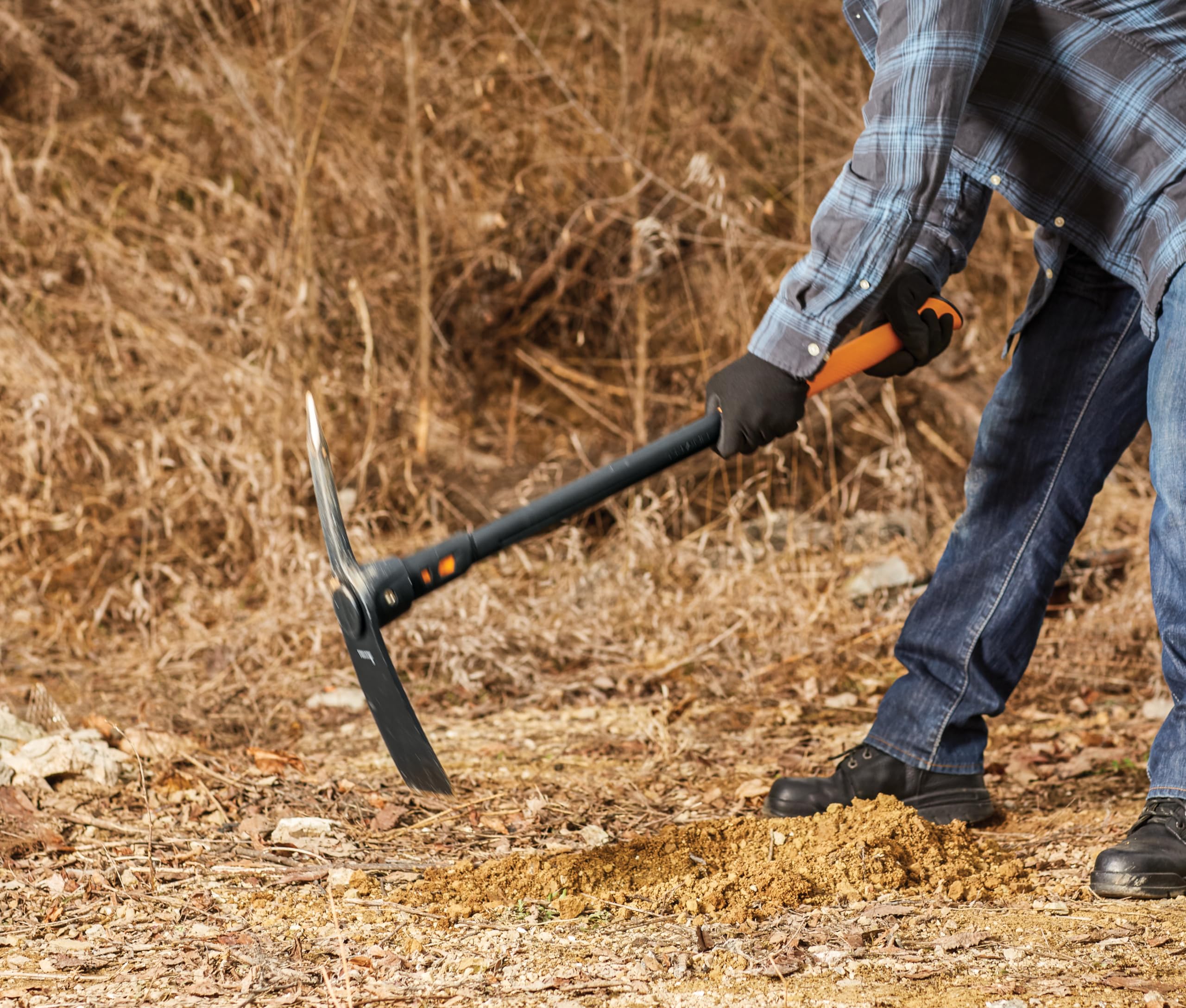Fiskars tool in use breaking compacted ground with less fatigue