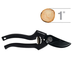Fiskars pruning shears cutting a branch with angled head to reduce wrist strain benefit ergonomics