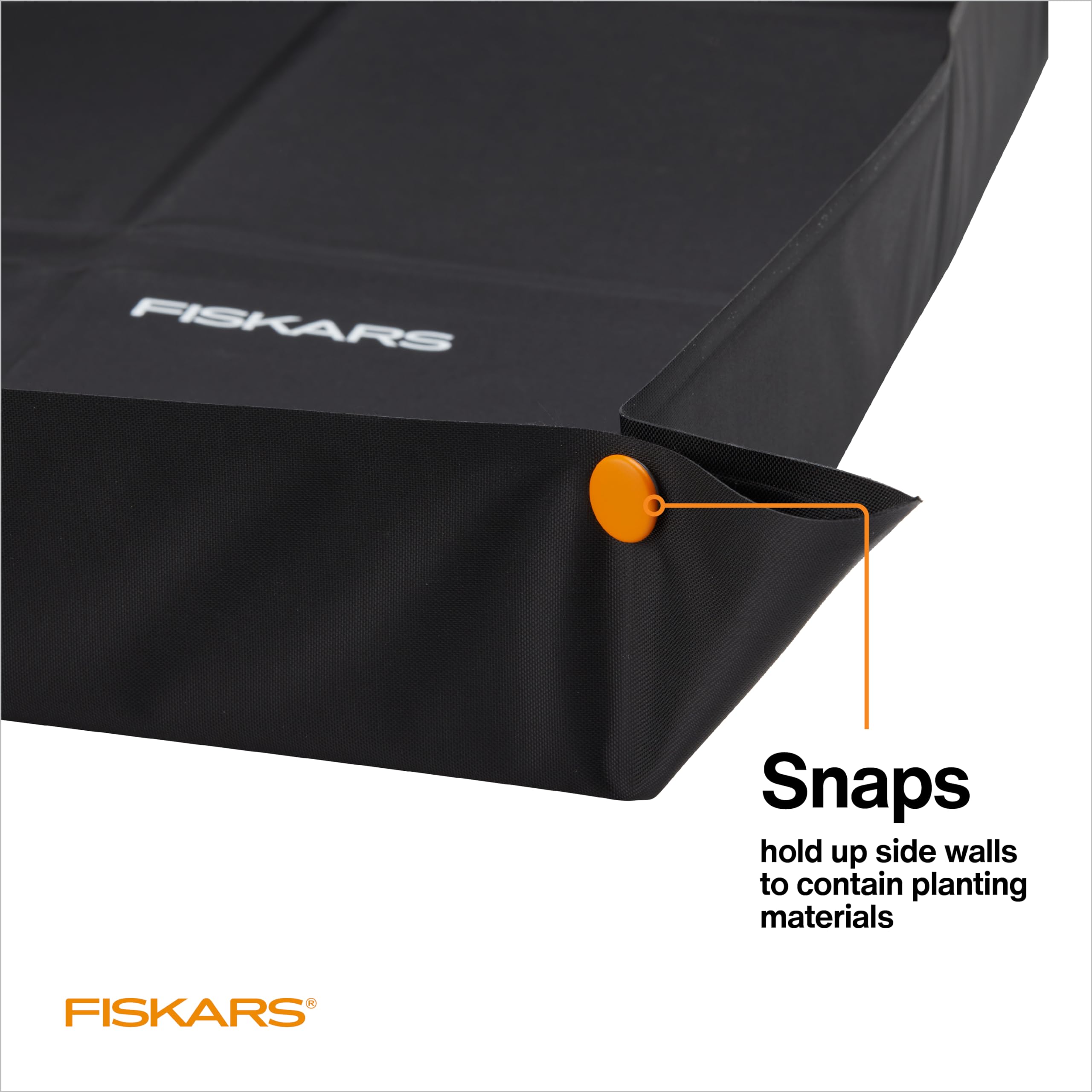Fiskars repotting mat corner snaps raised to contain soil and prevent spills