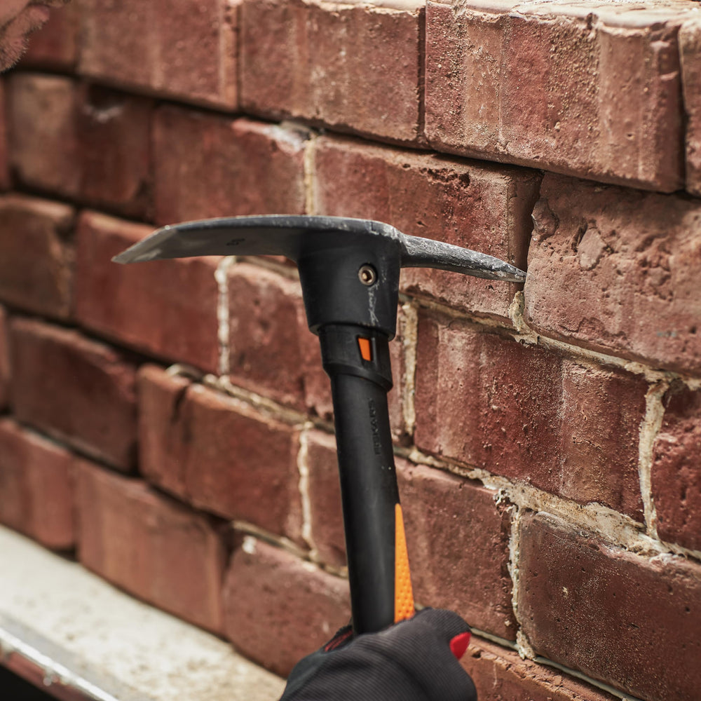 Fiskars tool beside tape measure showing 14-inch scale for portable handling