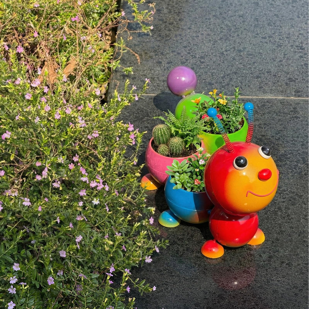 FKKsparkler side profile of metal caterpillar planter highlighting playful silhouette