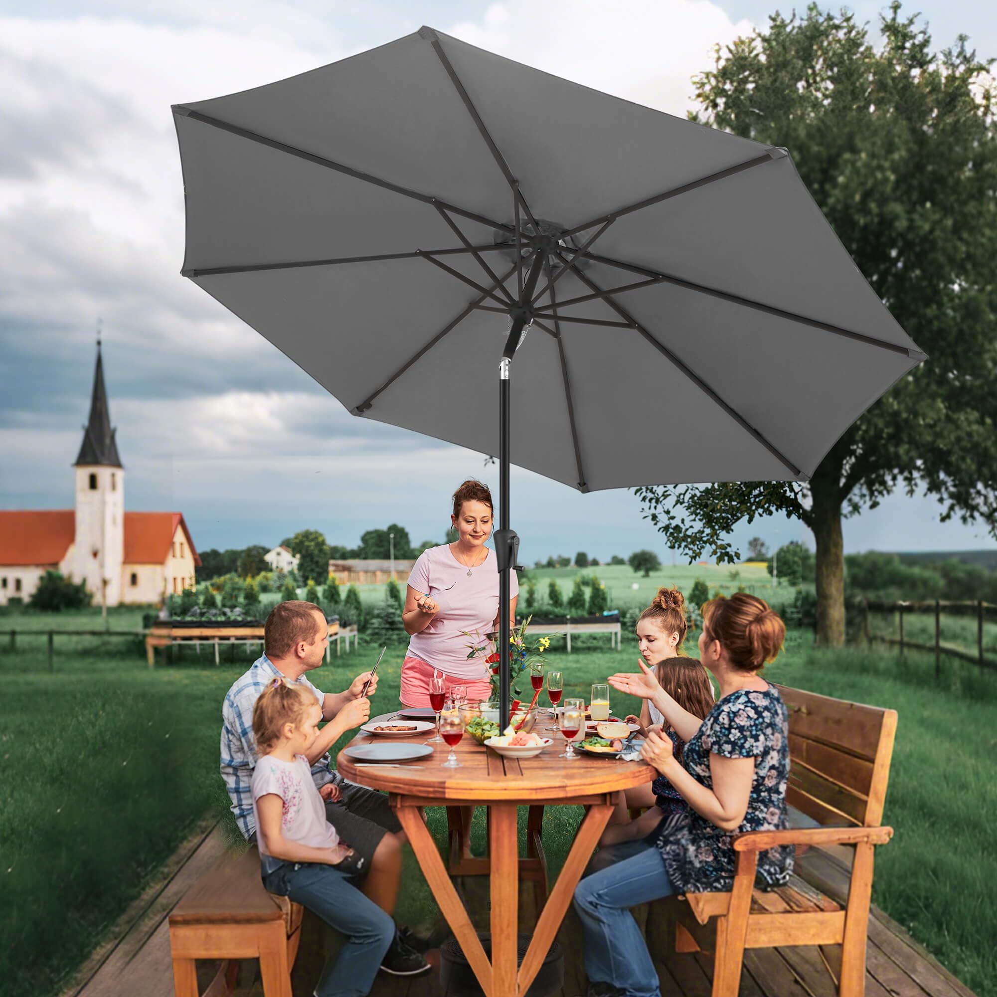 FLAME&SHADE umbrella beside chair showing scale and seat coverage benefit