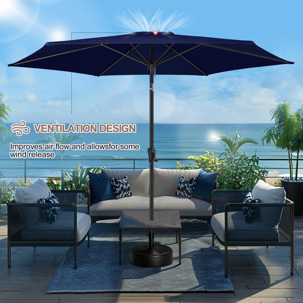 FLAME&SHADE 10 ft umbrella next to a table demonstrating coverage size