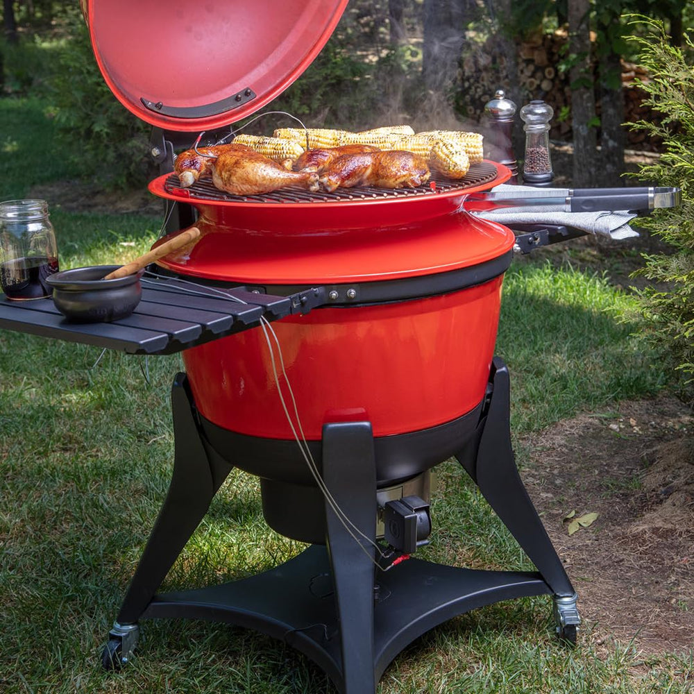 Flame Boss mounted on a kamado lid demonstrating better temperature stability while cooking