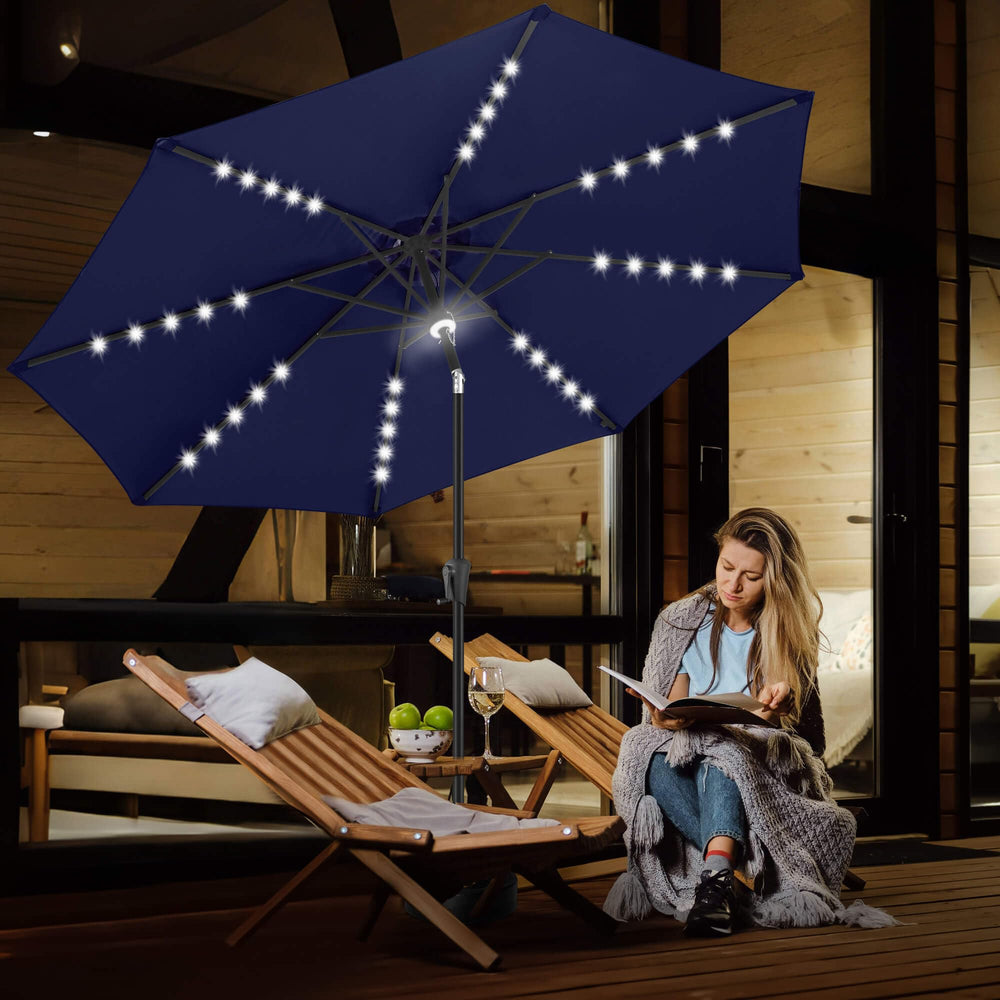 FLAME&SHADE umbrella over dining table showing illuminated outdoor use