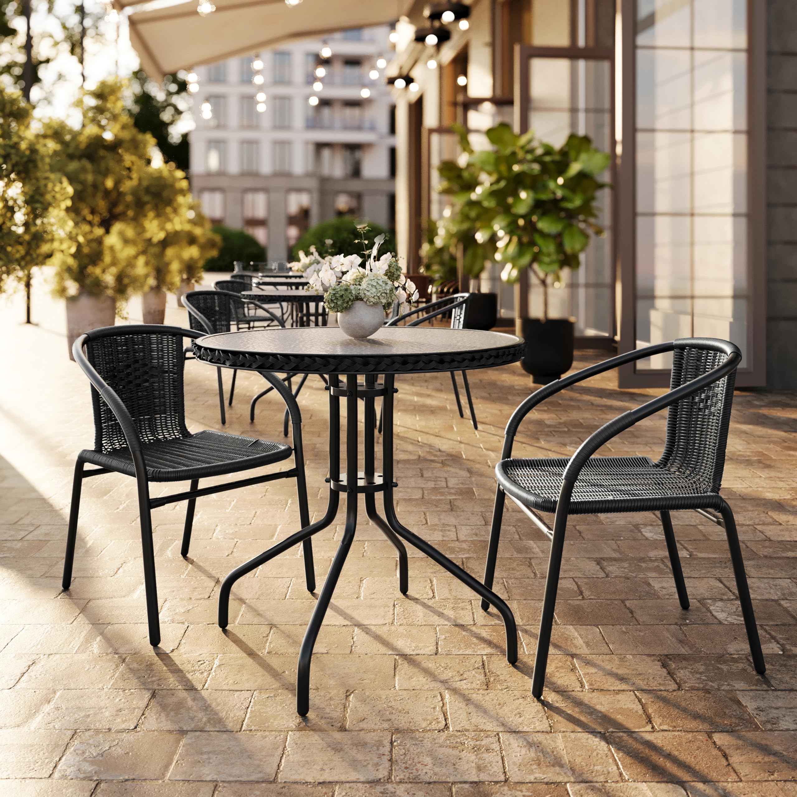 Flash Furniture chair on patio near table demonstrating outdoor dining use
