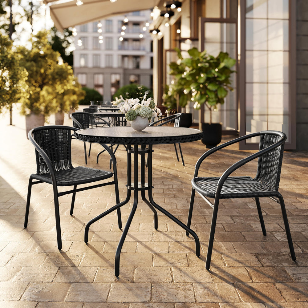Flash Furniture chair on patio near table demonstrating outdoor dining use
