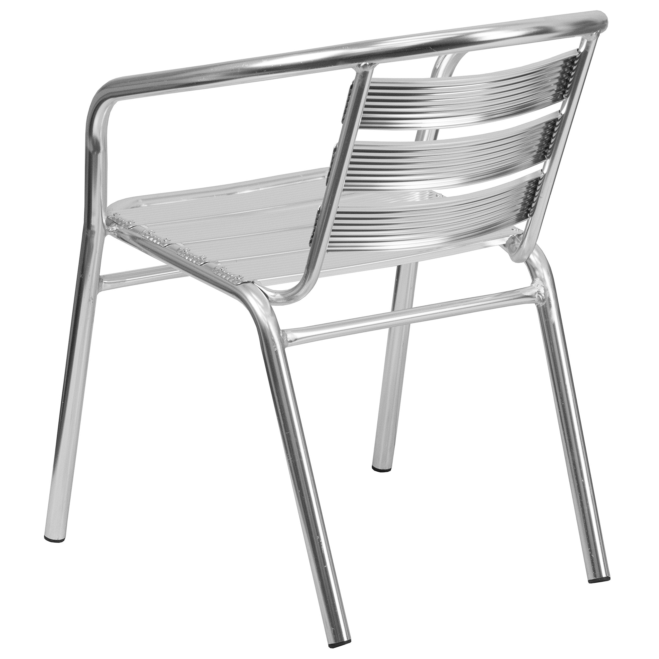 Flash Furniture next to dining table showing chair dimensions and fit
