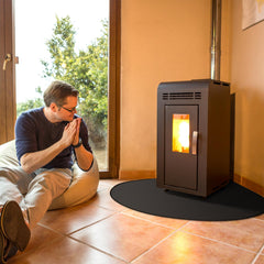 FLASLD pad placed at stove corner protecting hardwood floor from embers