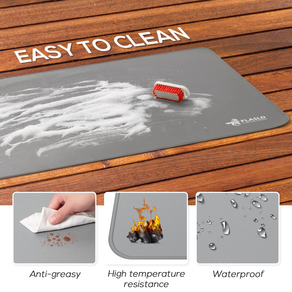 FLASLD under gas grill with a wiped-up grease spill showing easy cleanup