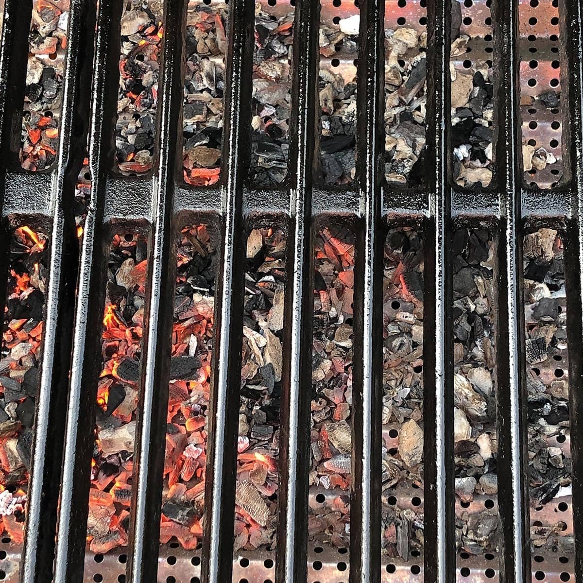 FlavrQ side profile showing edge fit inside grill for secure placement and simple removal