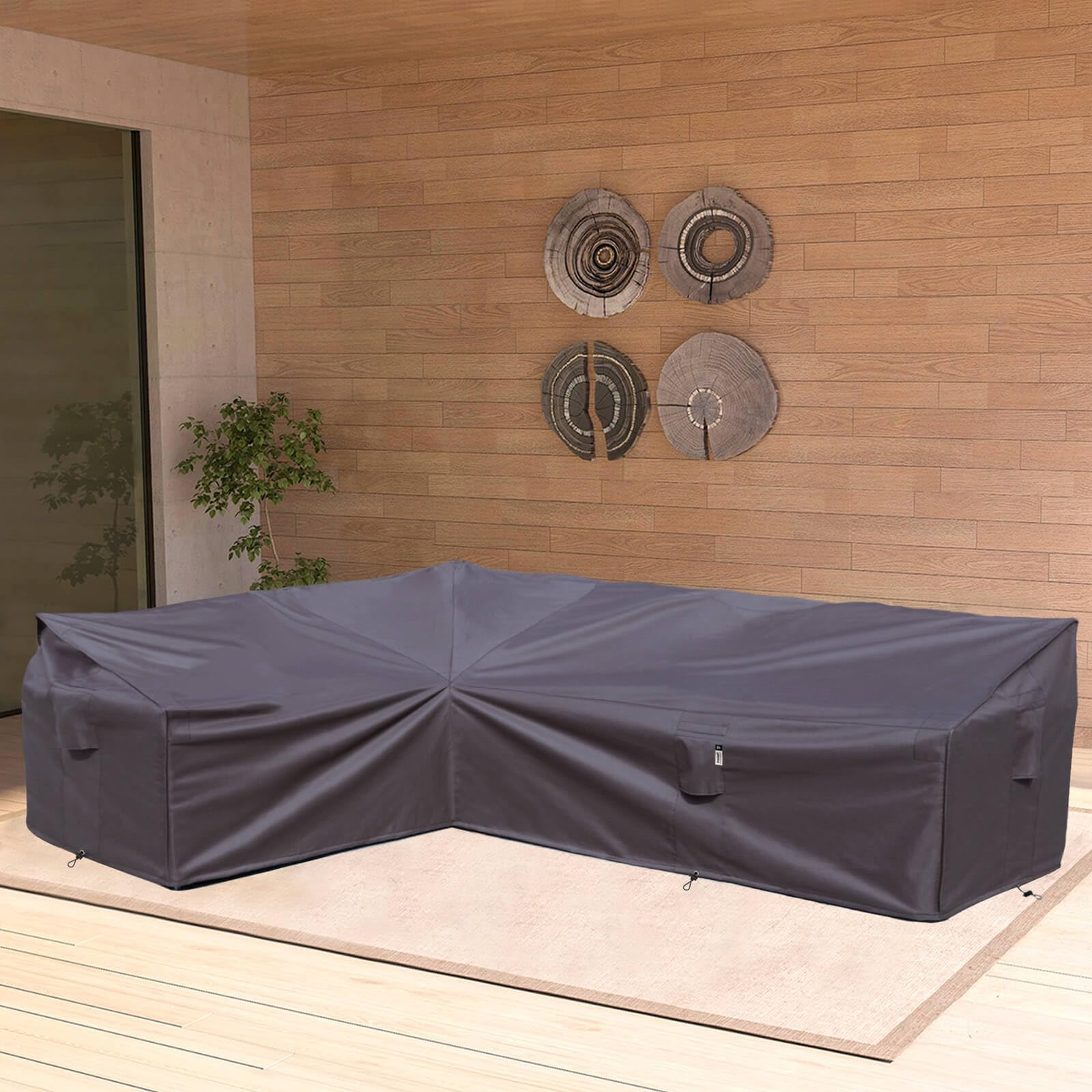 Flexiyard in-use on left-facing sectional couch protecting cushions from rain