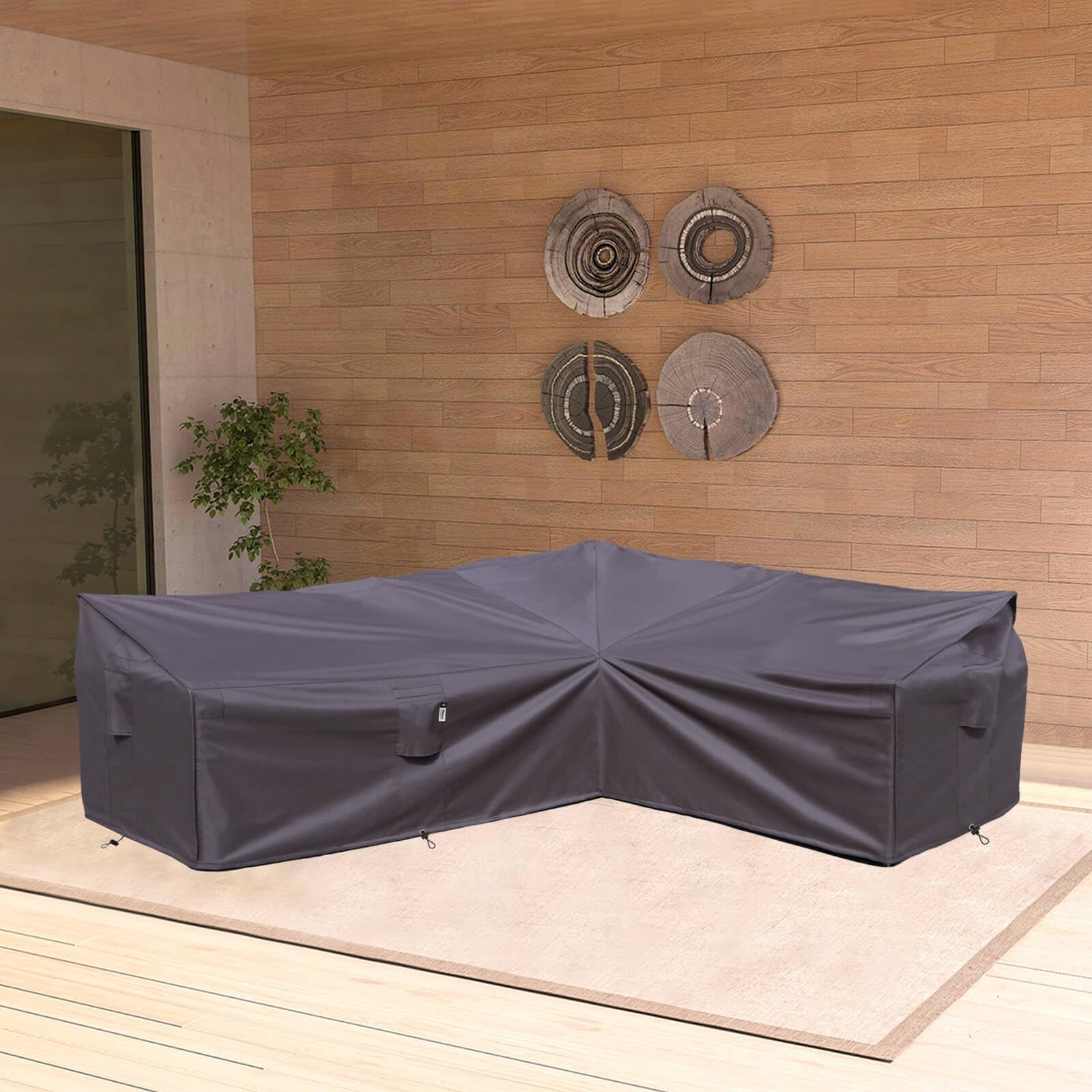 Flexiyard cover in a patio setting protecting furniture from rain and sun