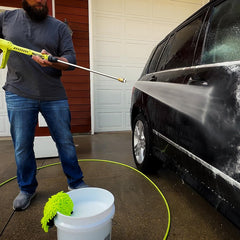 Flexzilla hose connected to pressure washer in action for tangle-free spraying