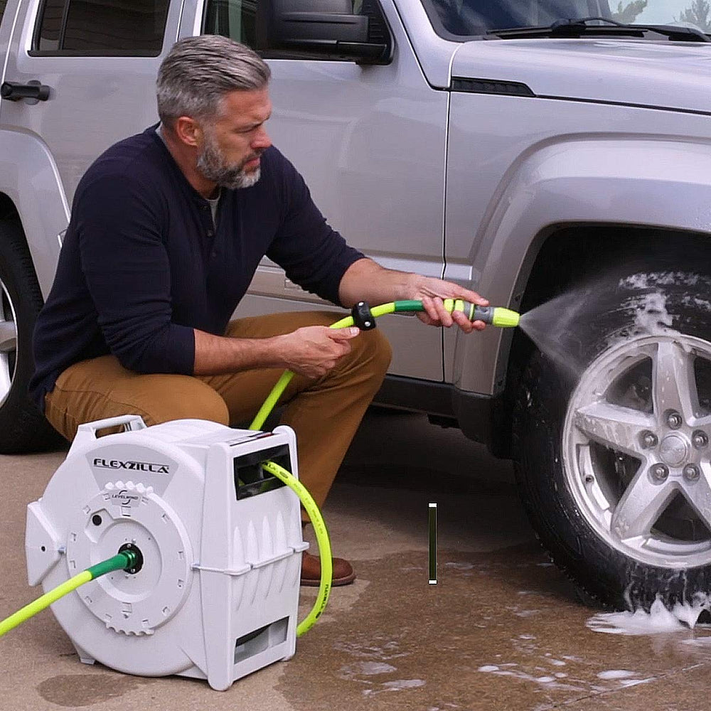 Flexzilla reel in use watering lawn showing fast deployment and tidy rewind convenience