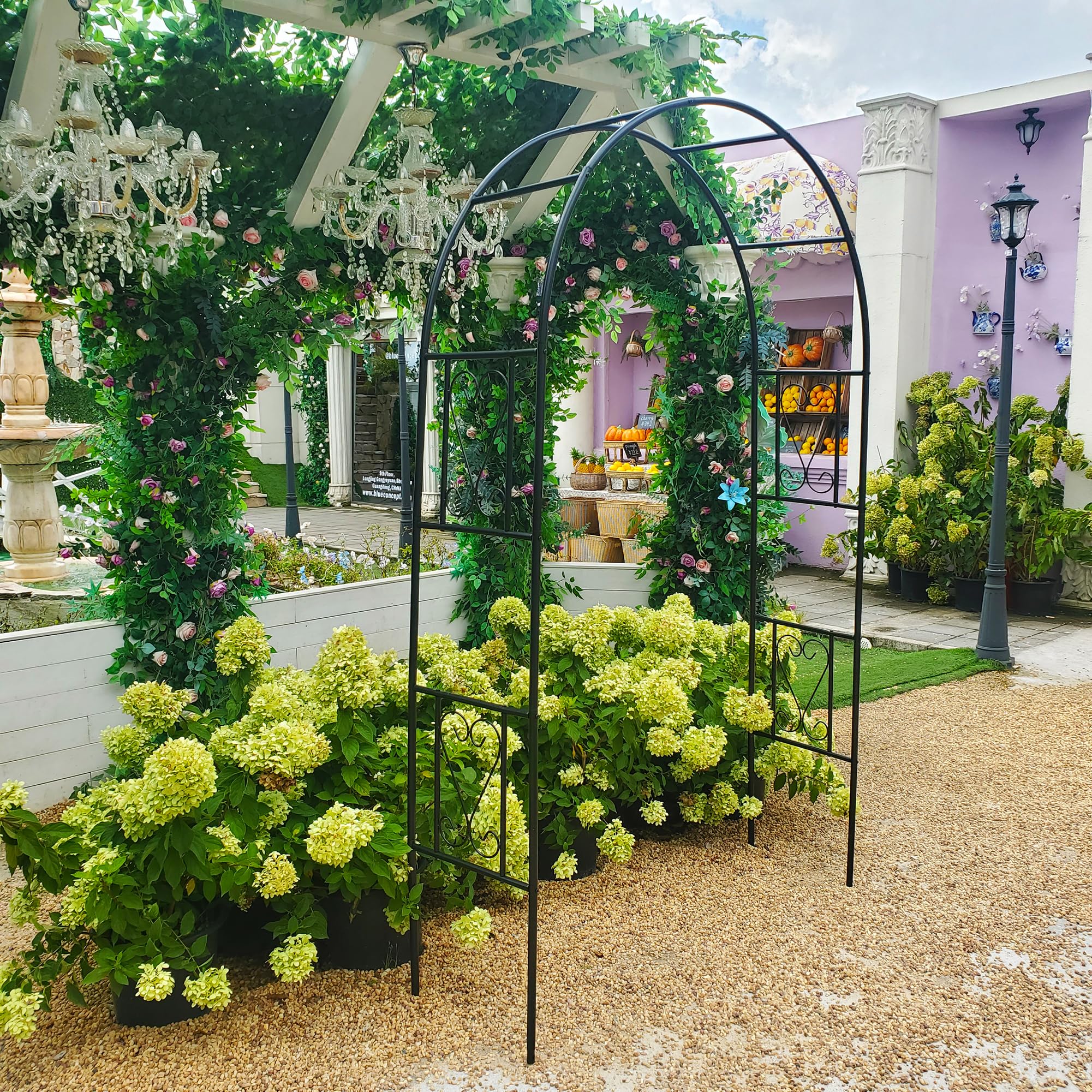 Flohover arch installed in backyard patio creating focal garden space