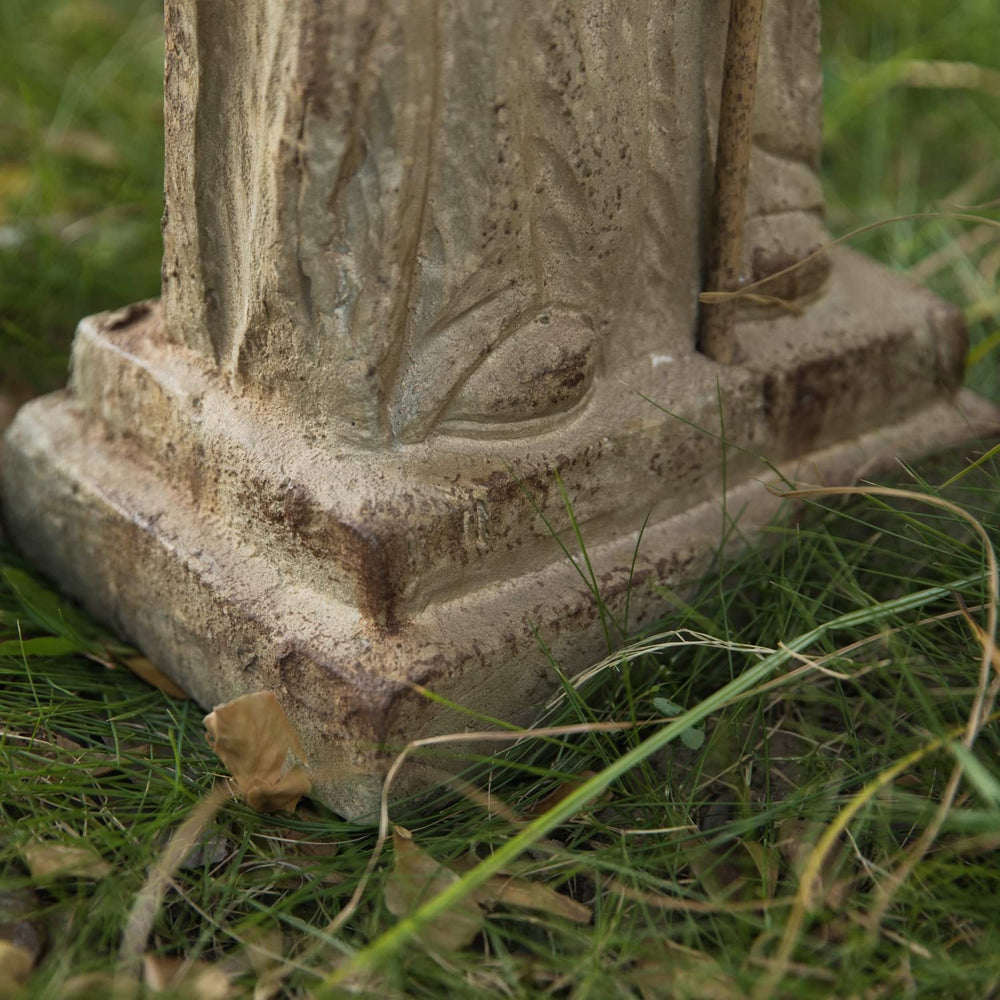 Flooreal statue placed in garden setting adding devotional focal point