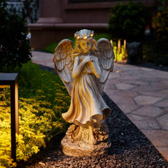 Floryden angel placed in a garden showing peaceful decor benefit