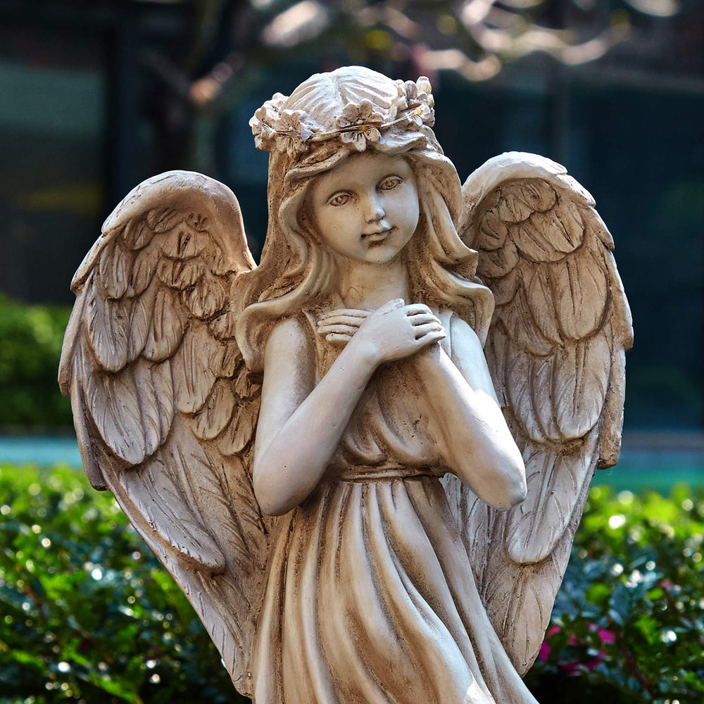 Floryden angel glowing at night showing soft LED illumination benefit