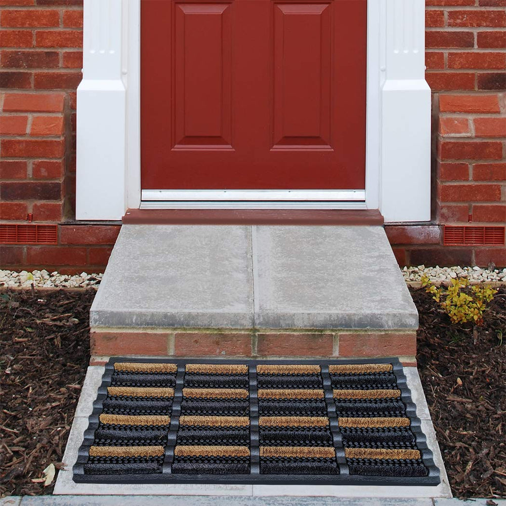 FOOTMATTERS mat in use with boot scraping off mud, prevents indoor tracking