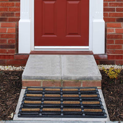 FOOTMATTERS mat in use with boot scraping off mud, prevents indoor tracking