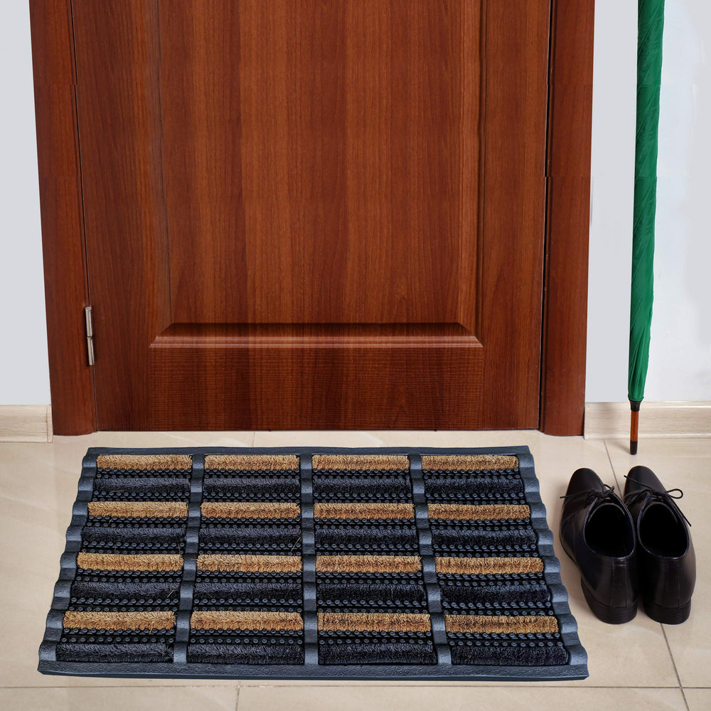 FOOTMATTERS mat placed in a doorway lifestyle scene, reduces entryway debris