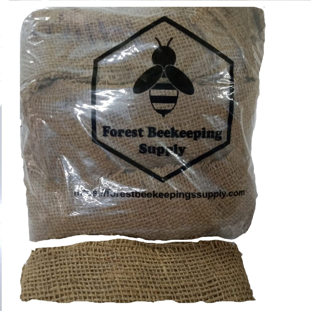 FOREST BEEKEEPING SUPPLY hobbyist using smoker during hive inspection for safety