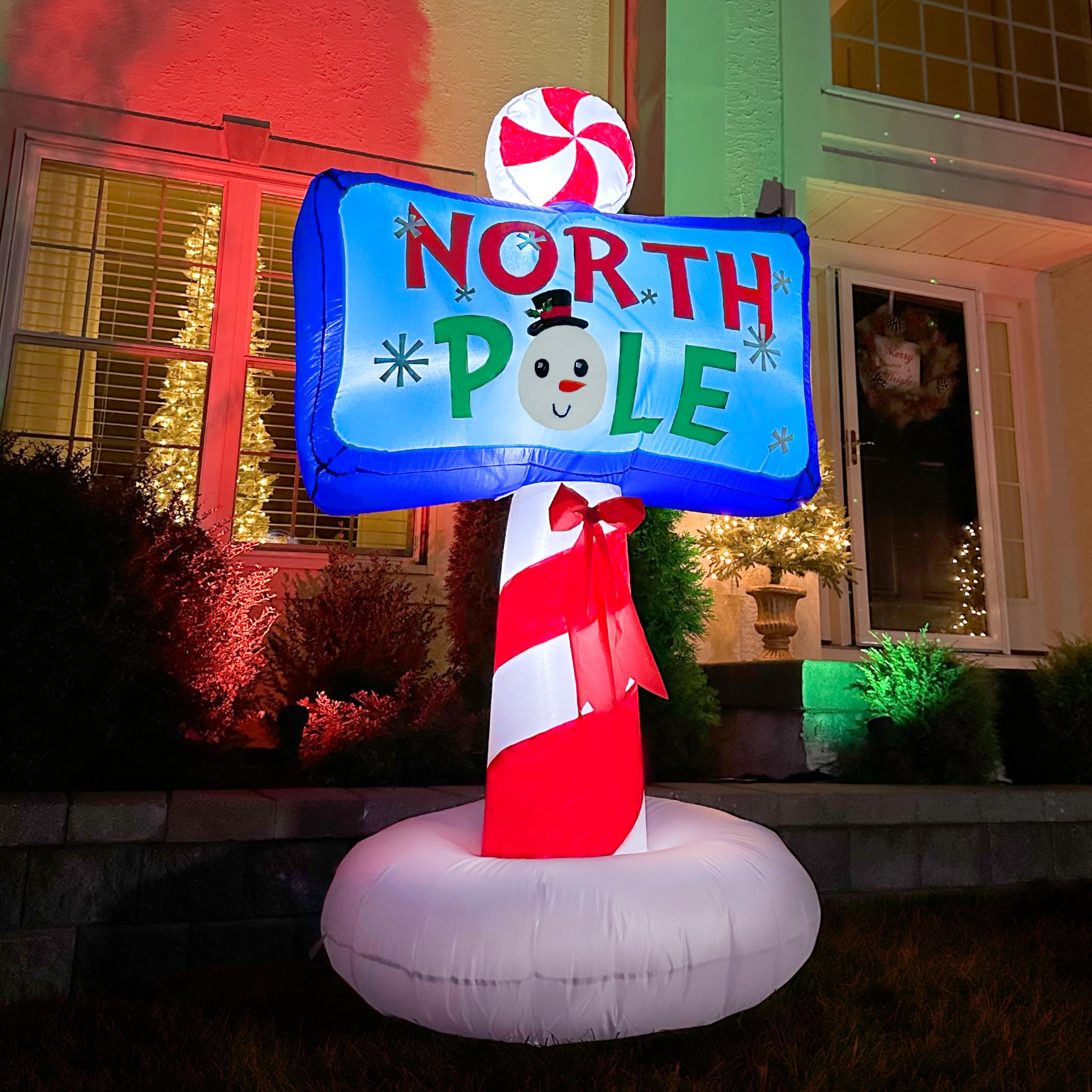 Fraser Hill Farm North Pole sign lit at night providing bright visibility