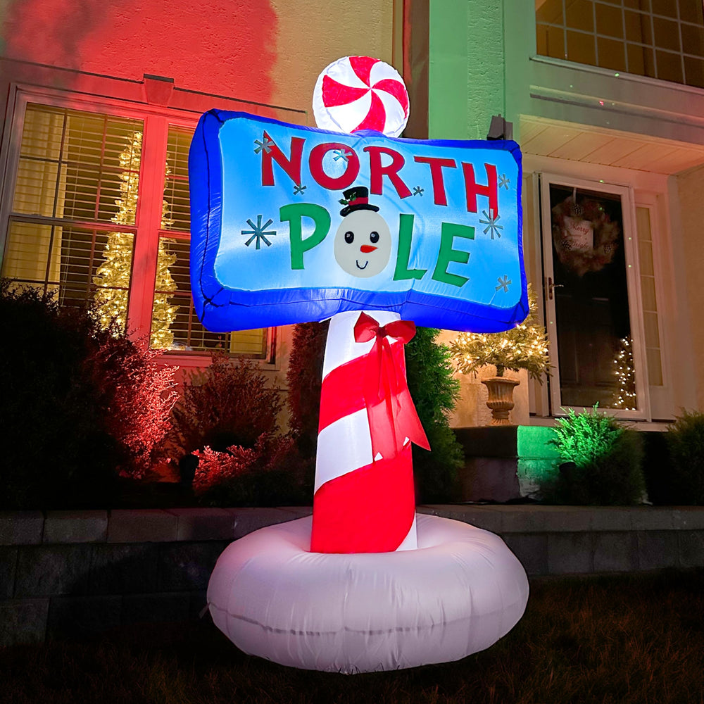 Fraser Hill Farm North Pole sign lit at night providing bright visibility