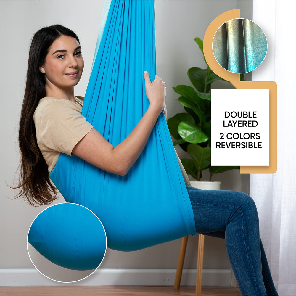 FRIENDLY CUDDLE pod swing hung on porch in lifestyle scene inviting relaxation