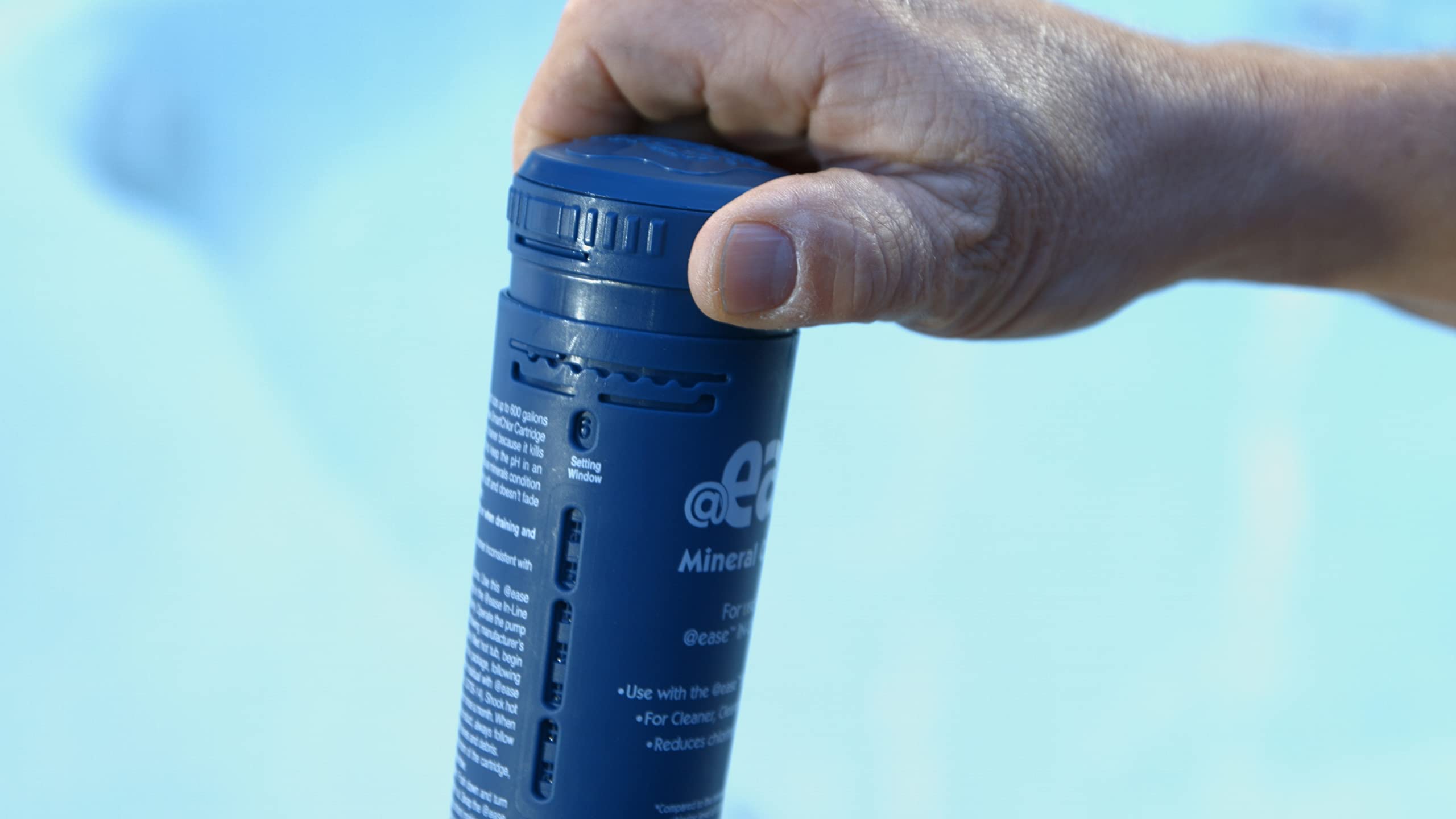 FROG cartridge next to hot tub filter showing size and replacement clarity benefit