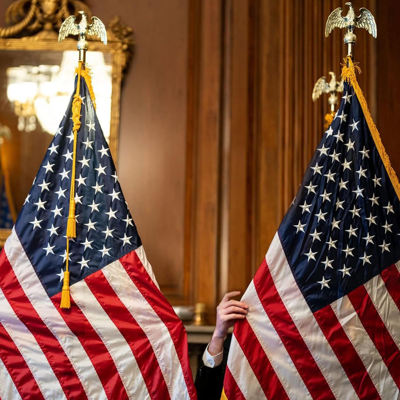 Frunke on a podium stage illustrating neat flag presentation for ceremonies