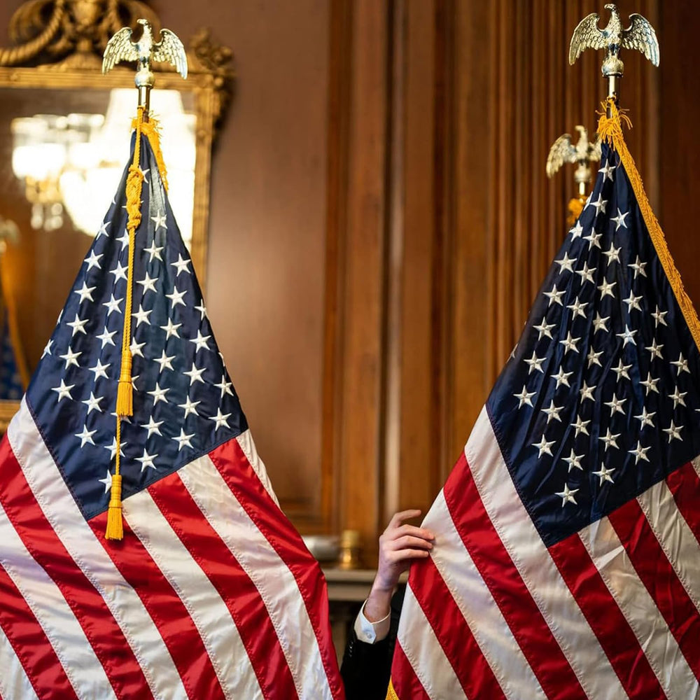 Frunke on a podium stage illustrating neat flag presentation for ceremonies