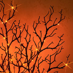 Fudios branches styled in a Halloween centerpiece adding spooky ambiance benefit