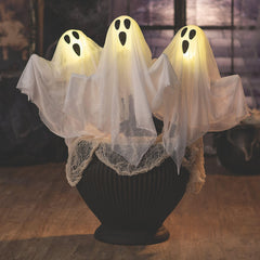 Fun Express ghost next to ruler and AA batteries showing 20-inch scale