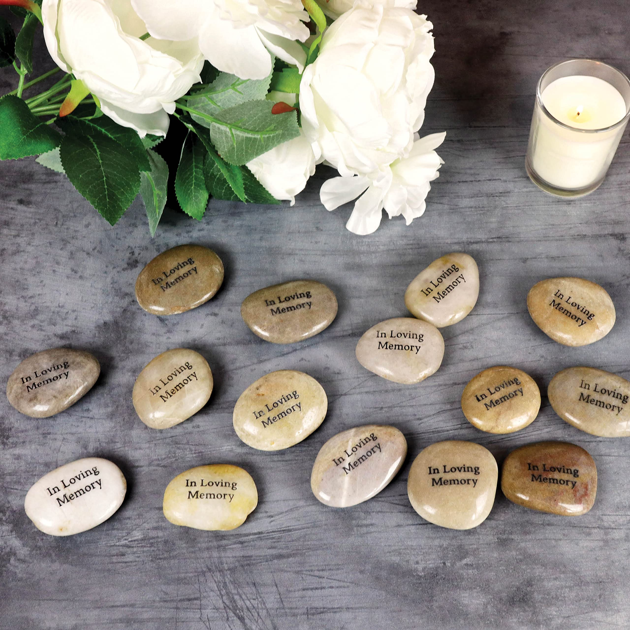 Funeral Favors stone held in hand showing smooth texture and comforting keepsake feel