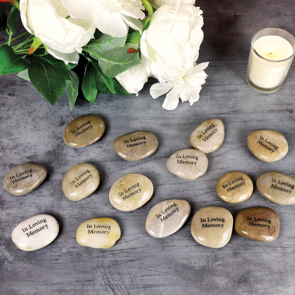 Funeral Favors stone held in hand showing smooth texture and comforting keepsake feel