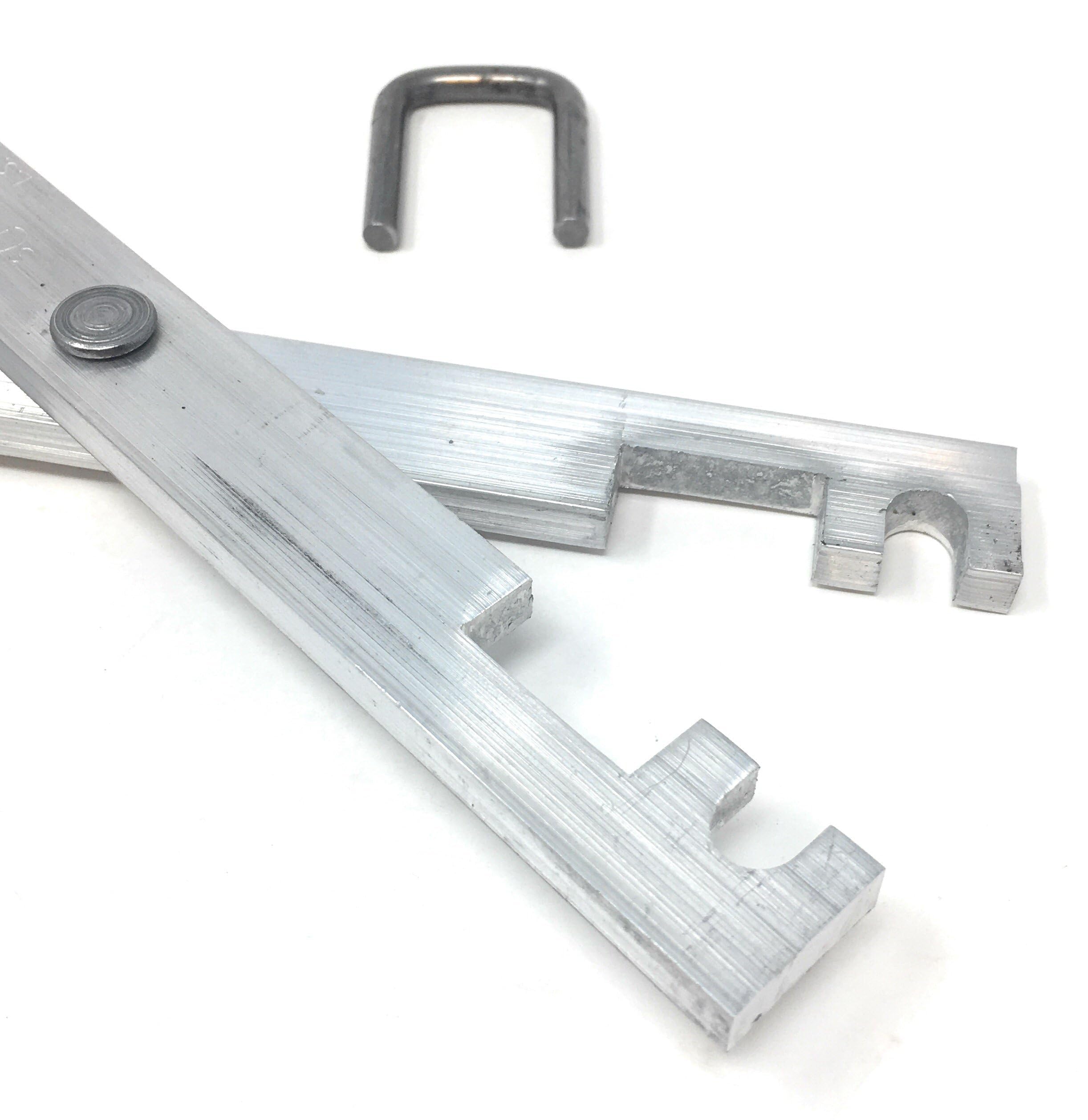 Funke Trap Tags in use compressing a bodygrip trap for safer placement