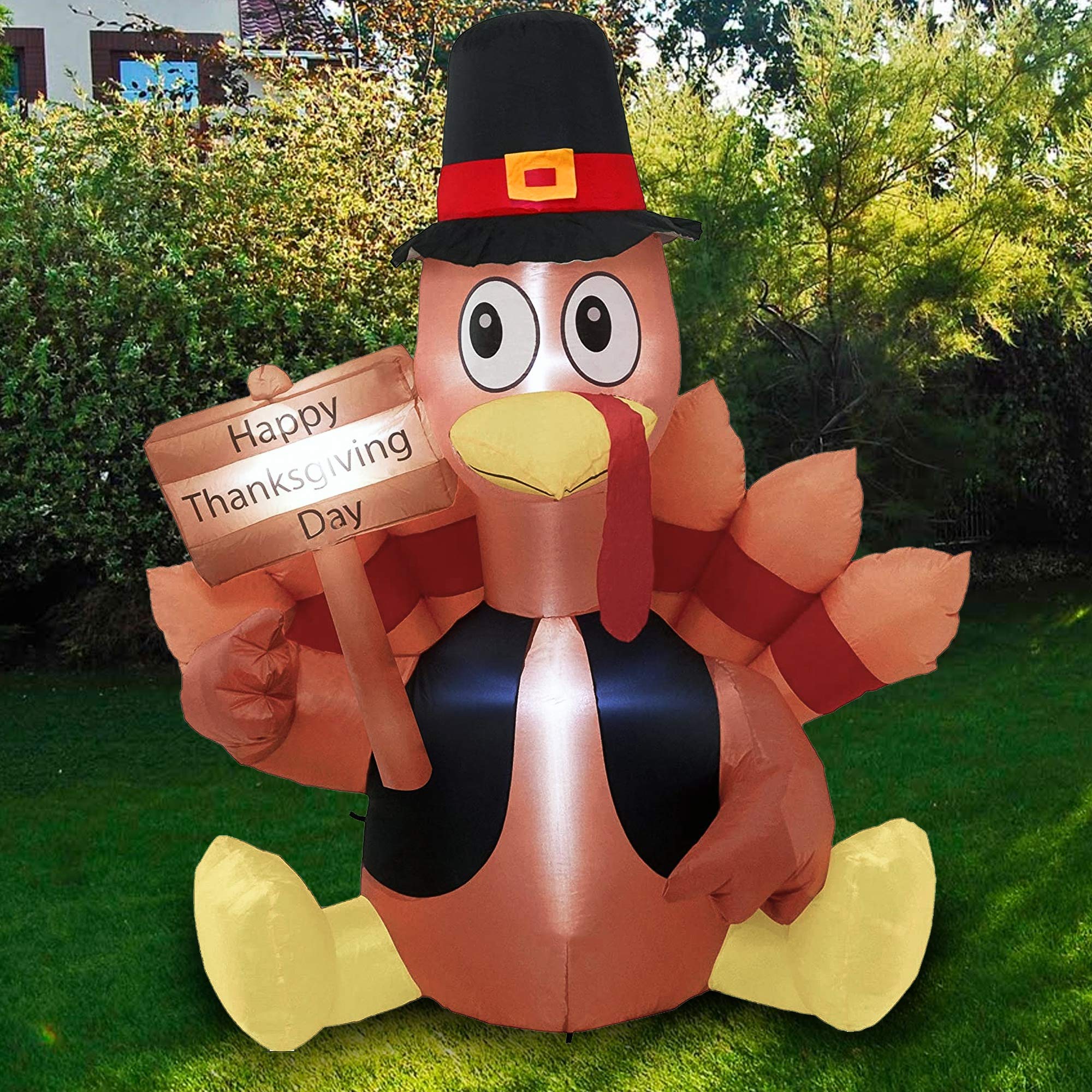 FUNPENY turkey staked into lawn with tethers and sandbag for stable outdoor display